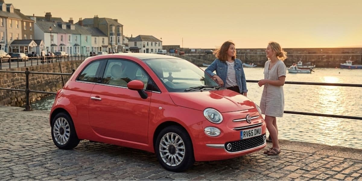 White Fiat 500 parked in an Italian street
