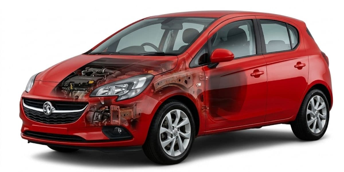 Young driver inspecting a used car before buying